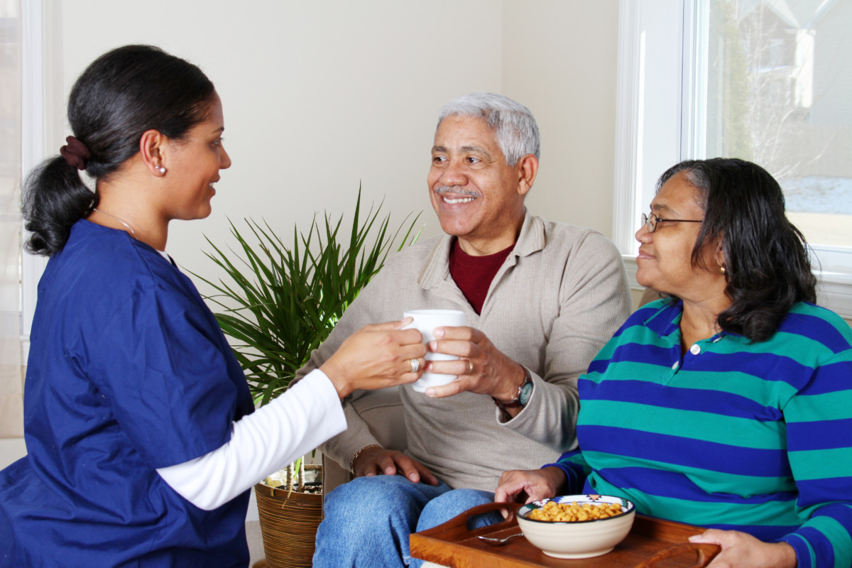 Caregiver reviewing care notes with a family member